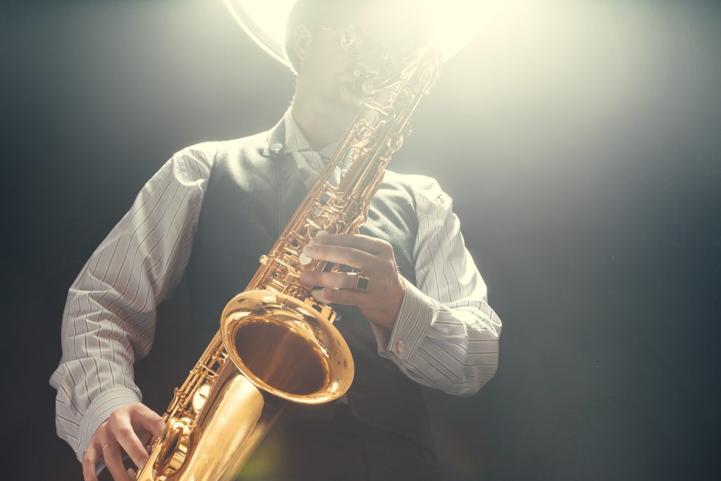 Young man playing the Saxophone