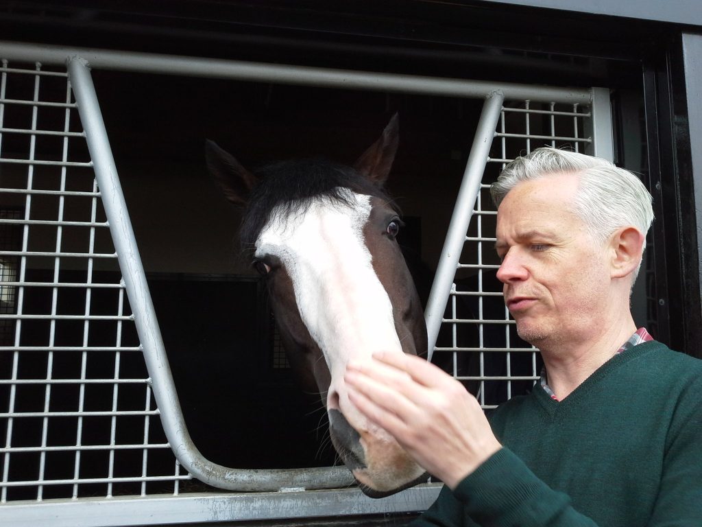 Nail Young with the star racehorse Talismanic at a stud-farm in Hokkaido, Japan